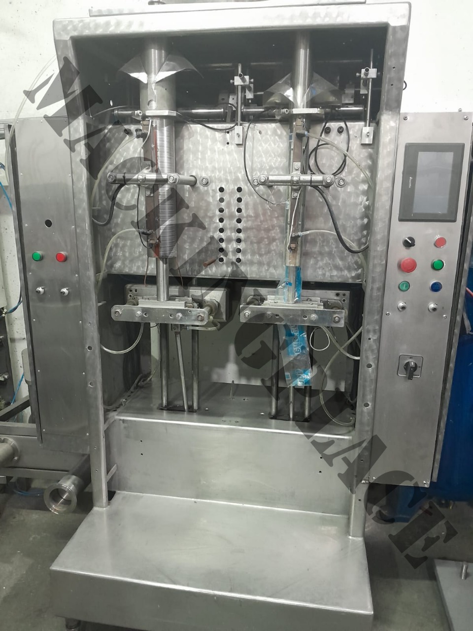 Llenadora doble cabezal de acero inoxidable con control por pantalla PLC